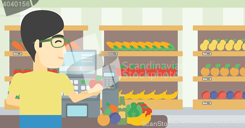 Image of Cashier standing at the checkout in supermarket.
