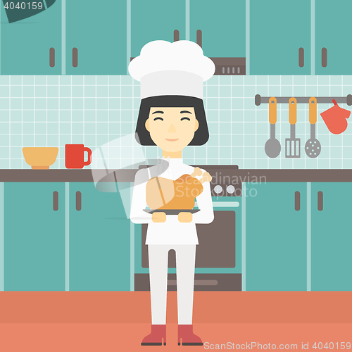 Image of Chief cooker holding roasted chicken.