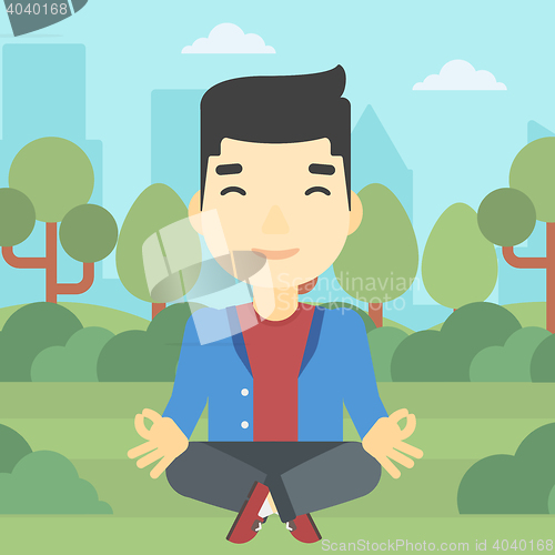 Image of Businessman meditating in lotus position.