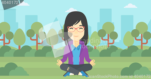 Image of Business woman meditating in lotus position.