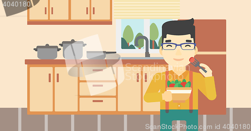 Image of Man eating healthy vegetable salad.
