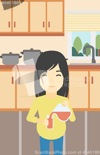 Image of Pregnant woman pouring juice.