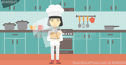 Image of Chief cooker holding roasted chicken.