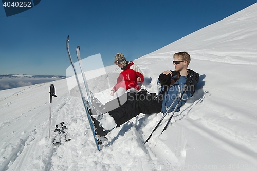 Image of Skiers having a rest