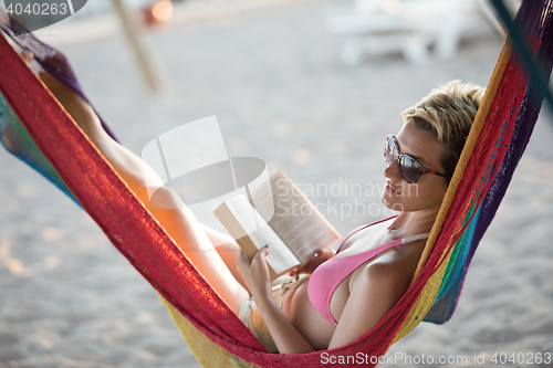 Image of relaxed woman laying in hammock