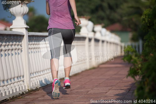 Image of sporty woman jogging