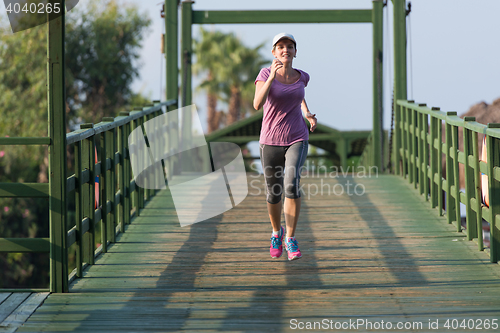 Image of sporty woman jogging