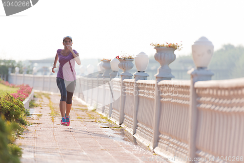 Image of sporty woman jogging