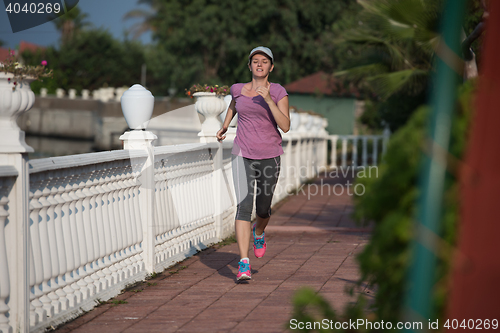 Image of sporty woman jogging