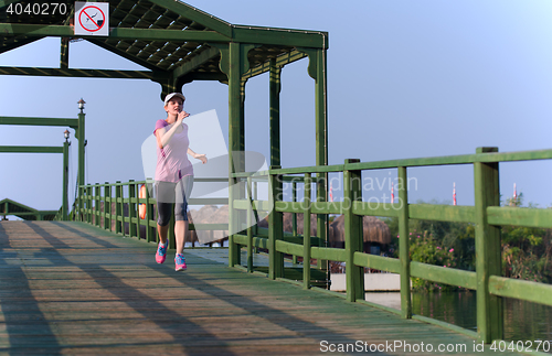 Image of sporty woman jogging