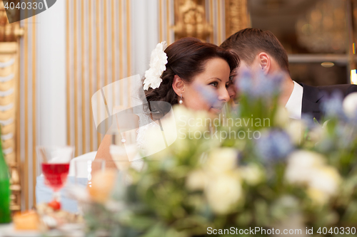 Image of Bride and groom share a special tender moment