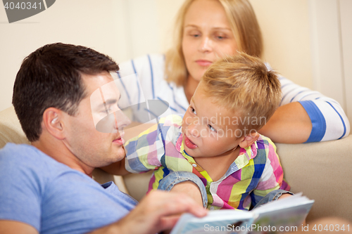 Image of Father reading to his young son