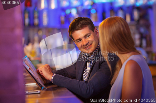 Image of Adult couple in bar