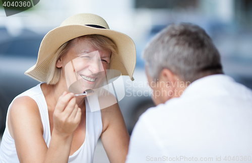 Image of Smiling happy woman relaxing with her husband