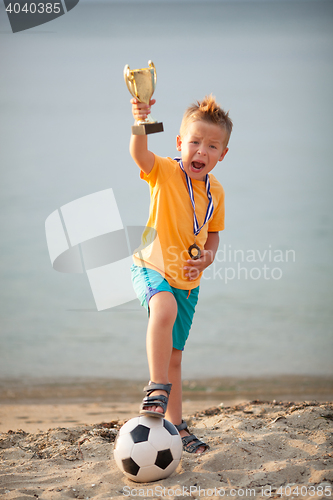 Image of Young Boy Celebrating Championship Soccer Win