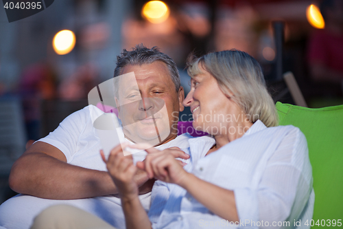 Image of Loving middle-aged couple having an intimate chat