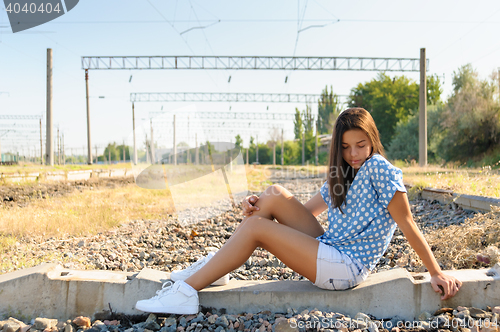 Image of Teenager girl in city outskirts