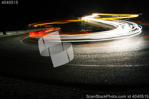 Image of Bright car lines on night road