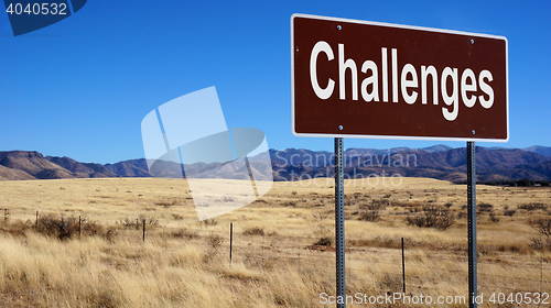 Image of Challenges brown road sign