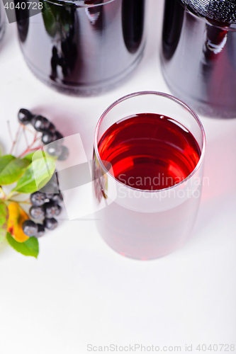 Image of Syrup made from aronia, glass and bottles