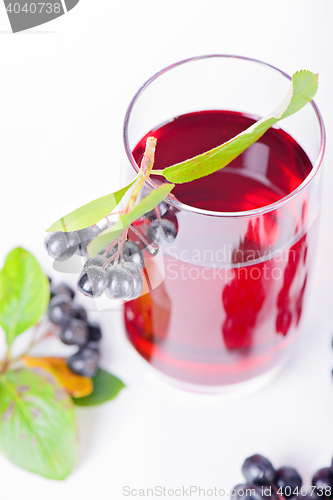 Image of Glass of aronia juice with berries