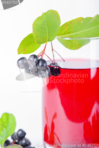 Image of Glass of aronia juice with berries