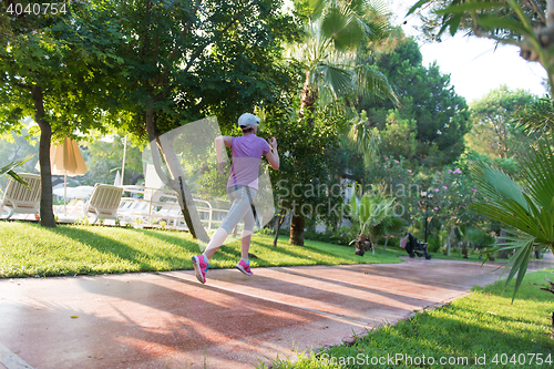 Image of sporty woman jogging