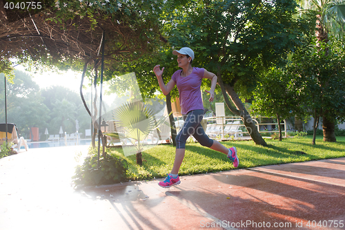 Image of sporty woman jogging