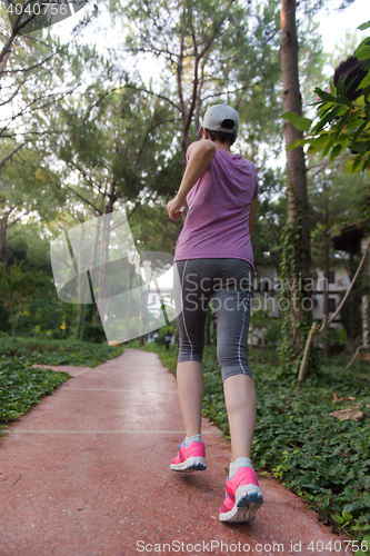 Image of sporty woman jogging