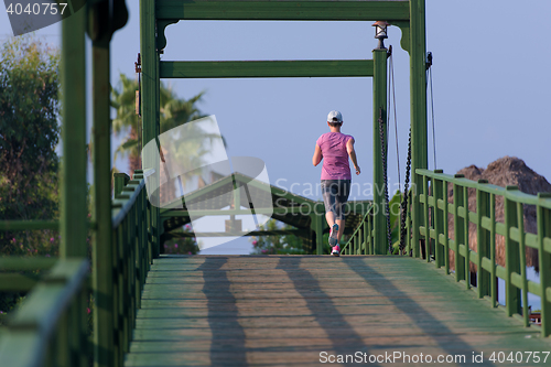 Image of sporty woman jogging