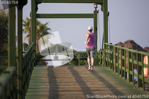 Image of sporty woman jogging