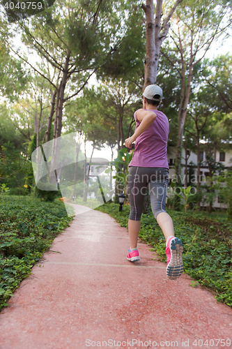 Image of sporty woman jogging