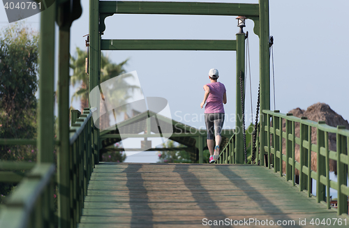 Image of sporty woman jogging