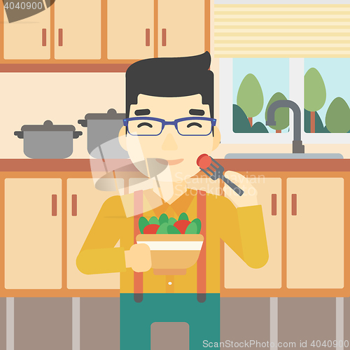 Image of Man eating healthy vegetable salad.