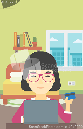 Image of Woman shopping online using her laptop.