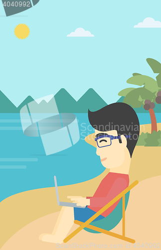 Image of Businessman working on laptop on the beach.