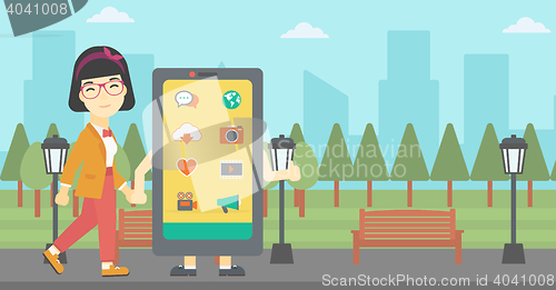 Image of Woman walking with smartphone.