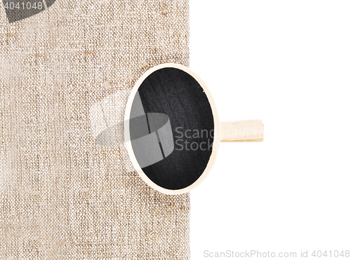 Image of Board with wooden peg on linen