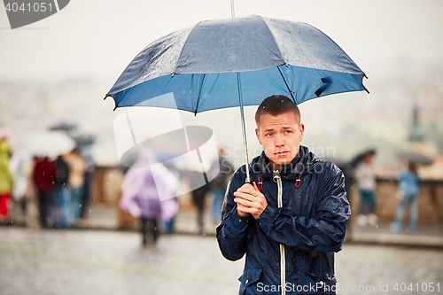 Image of Man in rainy day