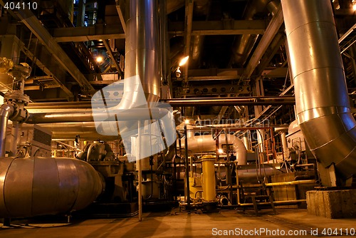 Image of Pipes and tubes and chimney at a power plant