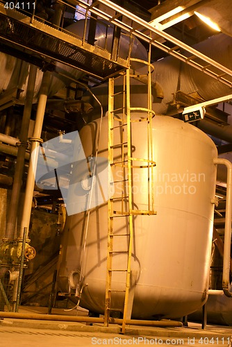 Image of Pipes and tubes and chimney at a power plant