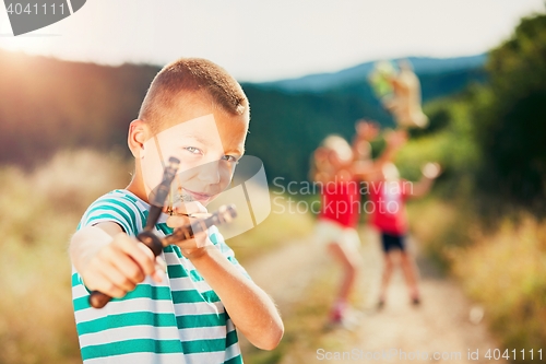 Image of Boy with slingshot