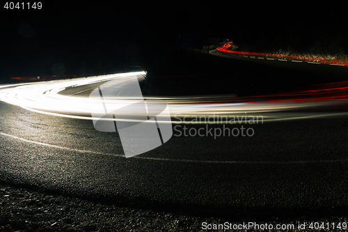 Image of Bright car lines on night road