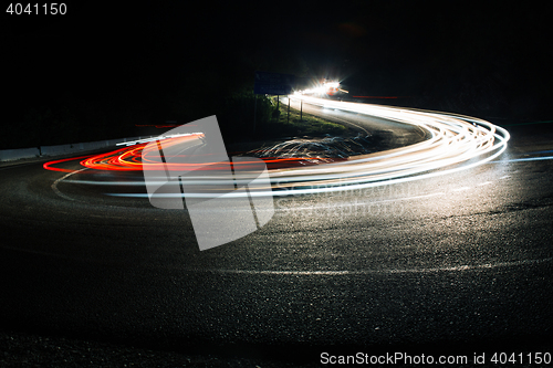 Image of Bright car lines on night road