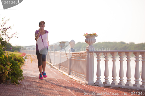 Image of sporty woman jogging