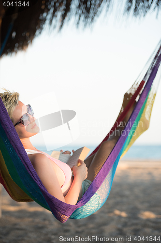 Image of relaxed woman laying in hammock