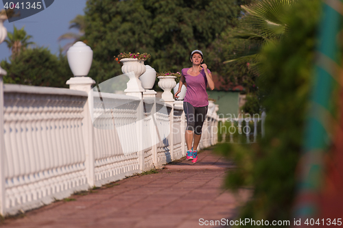 Image of sporty woman jogging