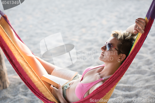 Image of relaxed woman laying in hammock