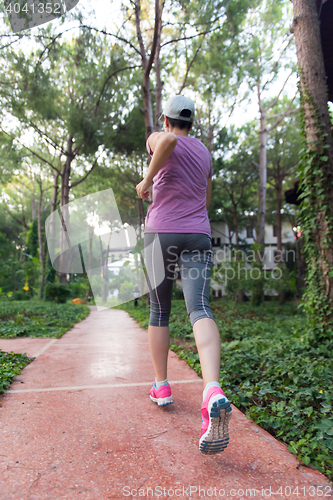 Image of sporty woman jogging