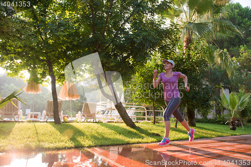 Image of sporty woman jogging